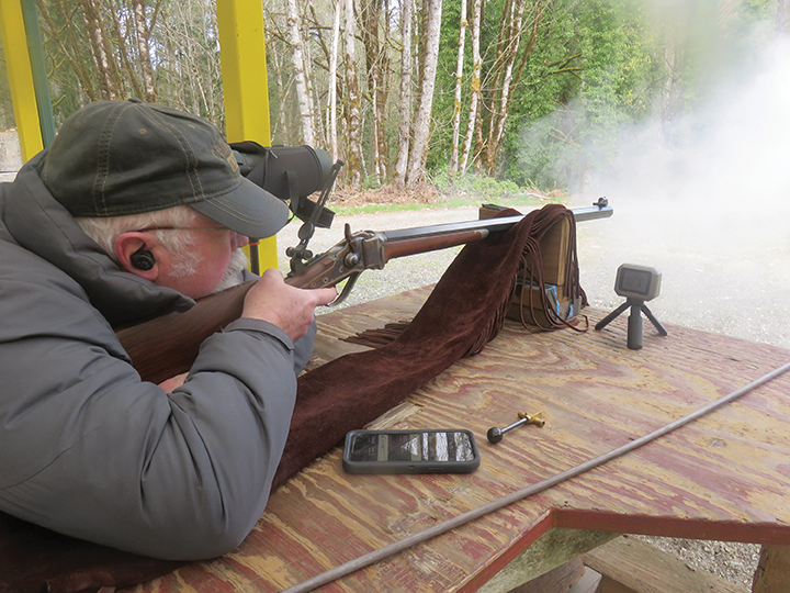 Shooting from the bench, Allen has just squeezed off a shot.